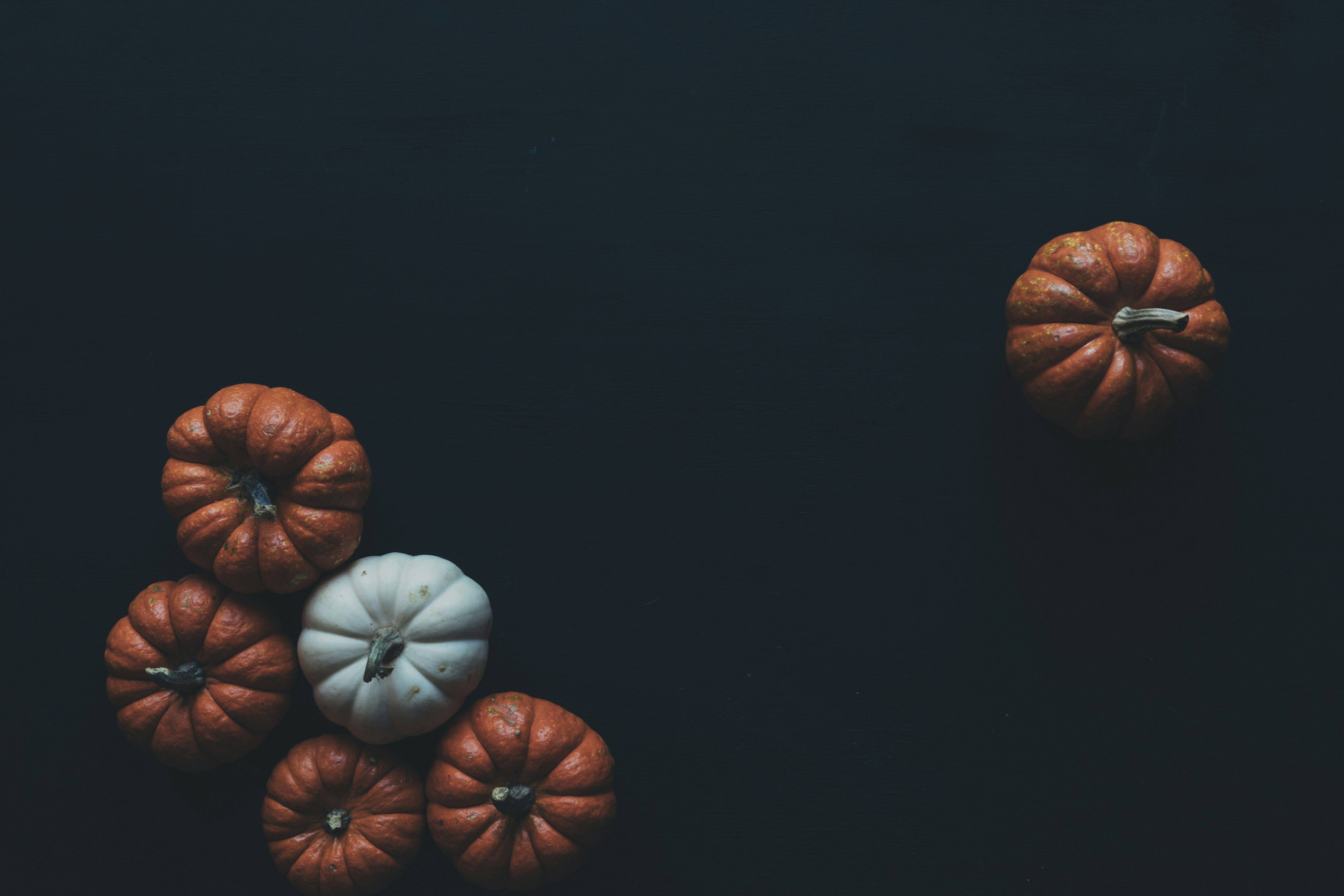 Pumpkins scattered on a table.